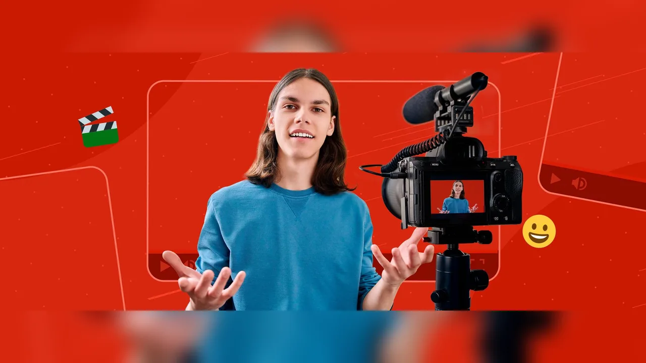 A video creator standing beside a camera against a red backdrop